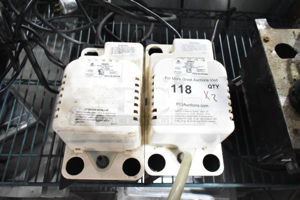 2 VCMA-20ULST pumps, 115V, 1 phase, used, labeled for auction, quantity 2, on metal shelf.