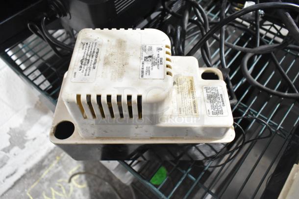 2 VCMA-20ULST pumps, 115V, 1 phase. Used condition, visible wear. Labels indicate voltage and model details.