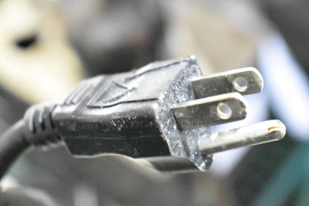 Close-up of a power plug connected to a 2 VCMA-20ULST pump, 115 volts, 1 phase, auction item.