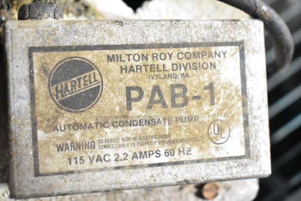Hartell PAB-1 Automatic Condensate Pump, 115V, 1 Phase, used condition, label visible with Milton Roy Company branding.