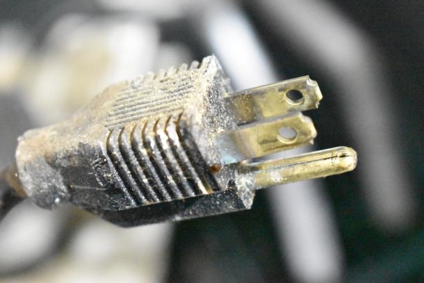 Close-up of a plug on a Hartell PAB-1 Automatic Condensate Pump, 115V, 1 Phase, showing wear.