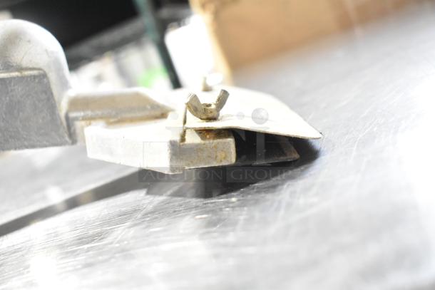 2 metal grill scrapers with ergonomic handles; show signs of use, some rust visible. Ideal for commercial kitchens.