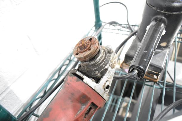 Assorted power tools including an angle grinder and Craftsman finishing sander. Visible wear, some rust. Eight items total.