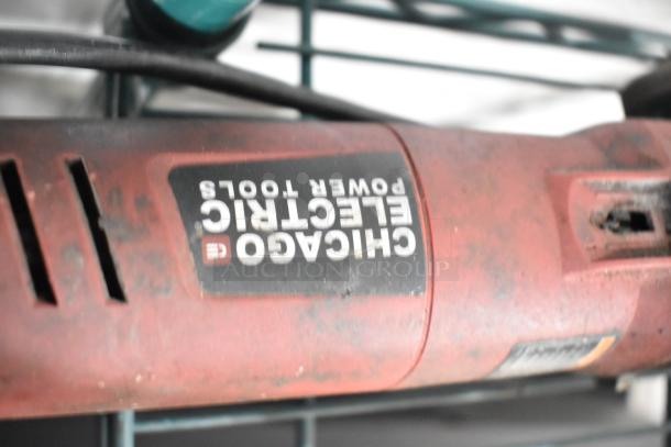 Angle grinder by Chicago Electric Power Tools with visible wear, part of an 8-item power tool auction set.
