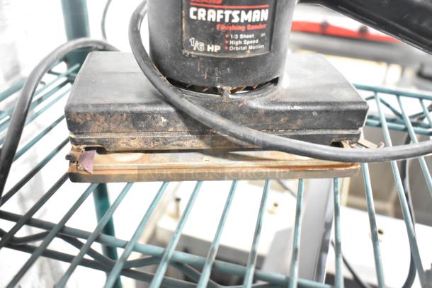 Craftsman finishing sander, 1/6 HP, 1/3 sheet, high speed orbital motion, visible wear, on teal wire shelf.