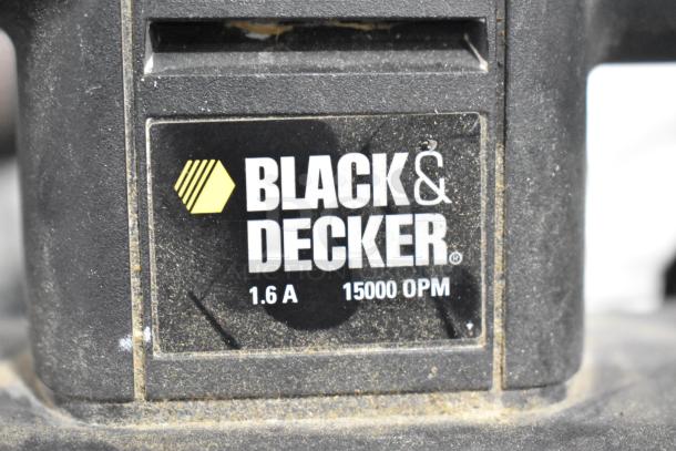 Black & Decker tool with 1.6A, 15000 OPM label, part of an auction set including sander, drill, and more.