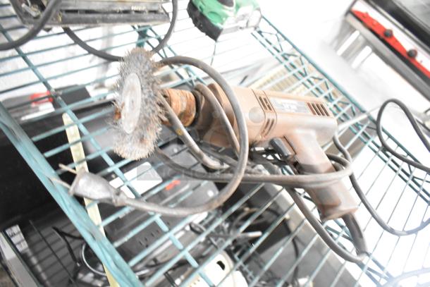 Assorted tools including a rusty angle grinder on a shelf, visible cord. Condition varies, good for repair or parts.