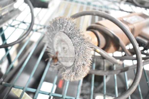 Eight tool set including an angle grinder, Craftsman sander, Black and Decker sander and drill, Hitachi impact driver, Skilsaw saw.