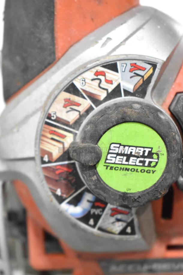 Close-up of a tool featuring "Smart Select Technology" dial with settings for different materials.