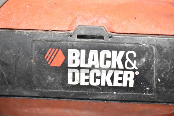 Assorted power tools including Black and Decker items. Condition varies; notable wear shown. Includes drills and sanders.