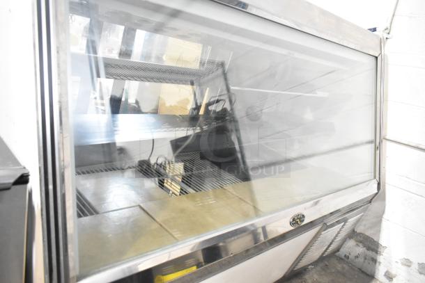 Marc Commercial Floor Style Deli Display Case Merchandiser, 115 Volts, 1 Phase. Features glass front and multiple shelves.
