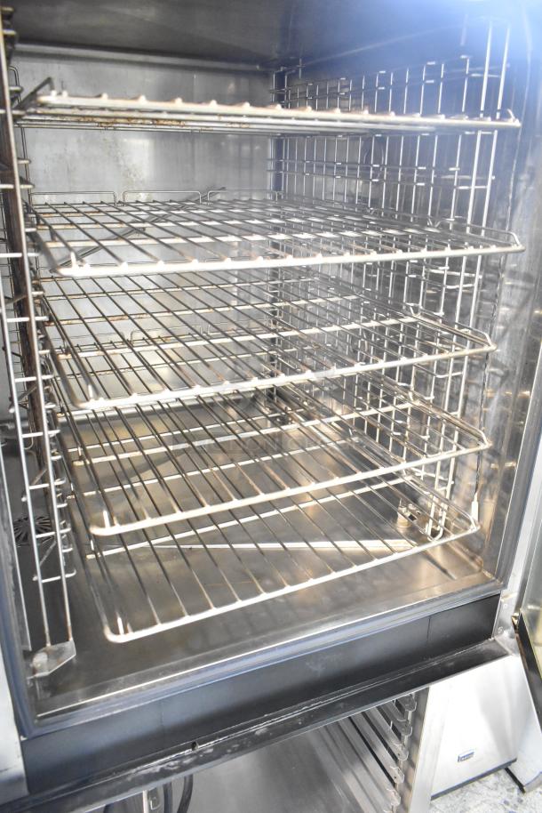 Electrolux Air-o-convect Touchline 9F92225200 commercial convection oven on stand with commercial casters, interior view.