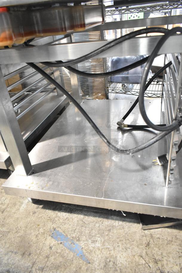 Electrolux Air-o-convect Touchline 9F92225200 convection oven on stainless stand with casters, power cords visible. Good condition.