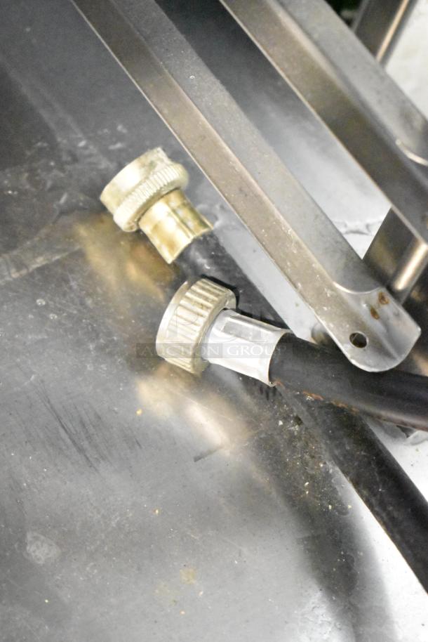 Close-up of fittings from Electrolux Air-o-convect Touchline Model 9F92225200, showing connectors and metal surface detail.