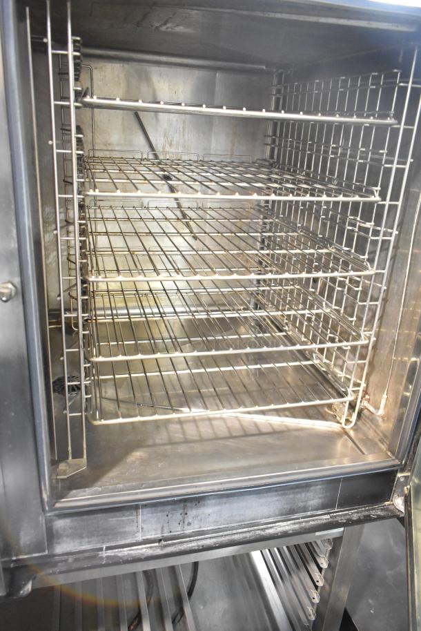Electrolux Air-o-convect Touchline 9F92225200 convection oven on stand, stainless steel racks, visible commercial casters.