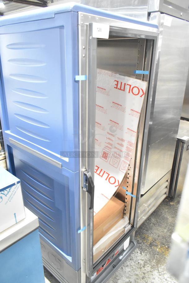 Brand new Metro C539-HLFC-U C5 insulated hot holding cabinet, missing glass, on commercial casters, blue finish.