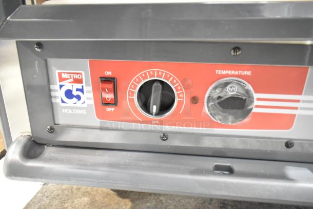 Brand new Metro C539-HLFC-U C5 hot holding cabinet controls, missing glass, with on/off switch and temperature dial.
