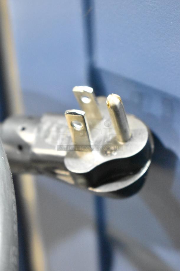 Close-up of a power plug attached to a Metro C539-HLFC-U C5 hot holding cabinet. Cabinet is missing glass.