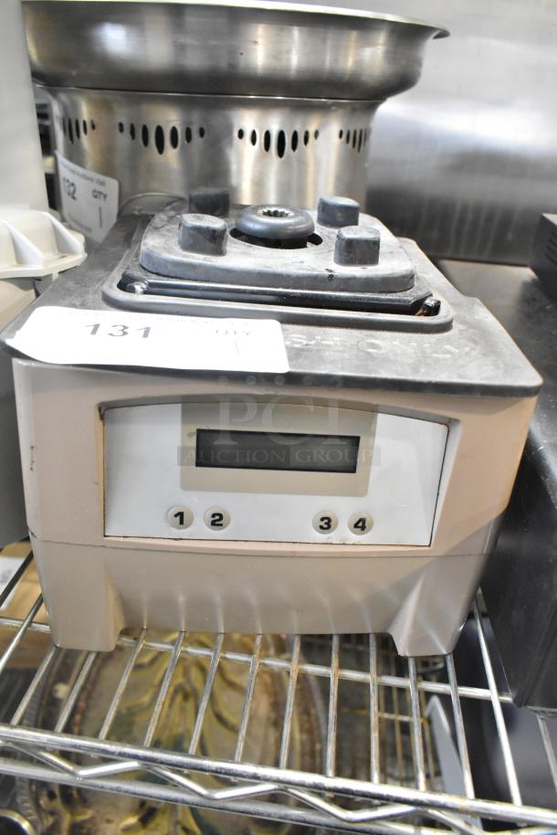 Countertop blender base, 115 volts, 1 phase, with control buttons labeled 1-4 and a digital display. Moderate wear.