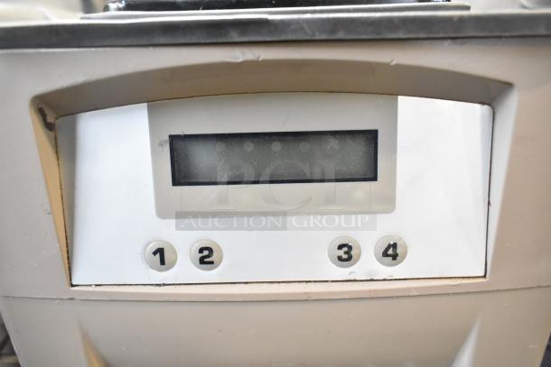 Countertop blender base with digital display, four control buttons. Condition shows minor wear. Model: 115 Volts, 1 Phase.