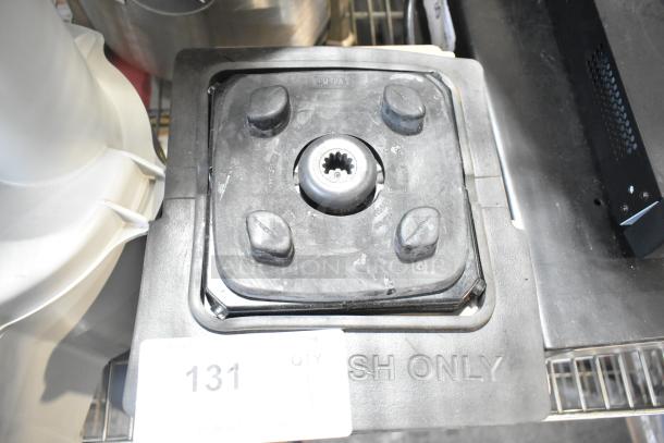 Countertop blender base, black, 115 volts, 1 phase. Features sturdy rubber mounts and a central drive socket. Visible "WASH ONLY" marking.