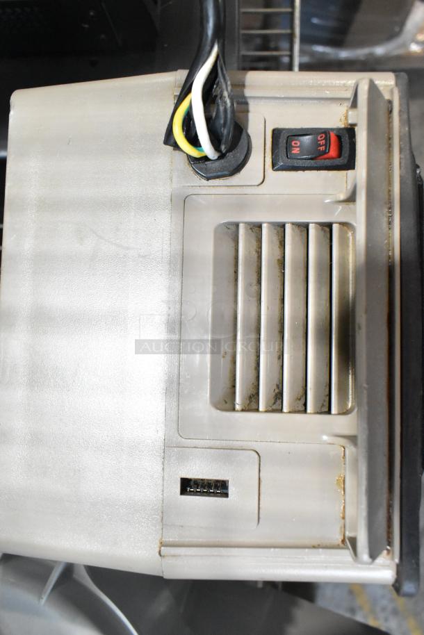 Countertop blender base, 115 volts, 1 phase, with on/off switch and cord. Visible signs of wear, functional condition.