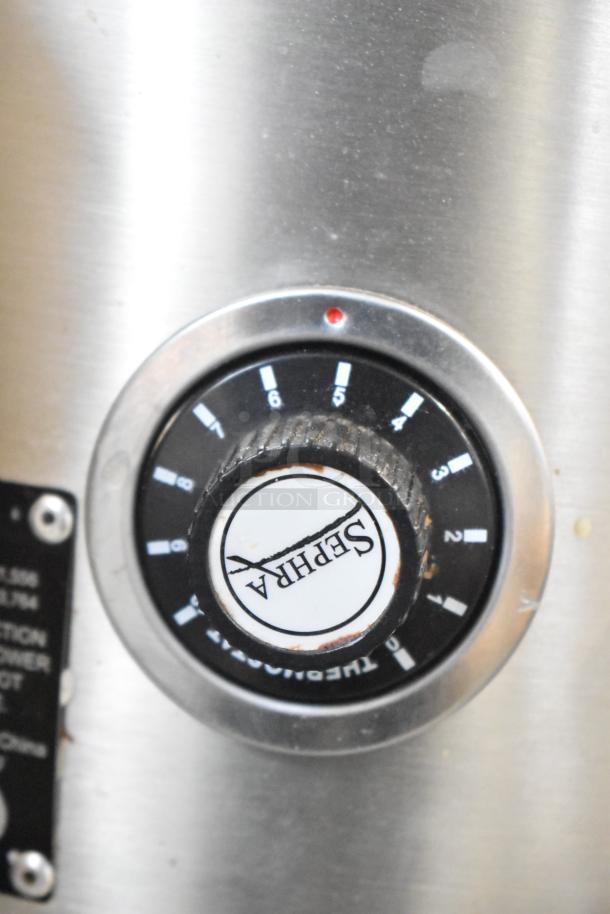 Sephra CF27 Countertop Fountain dial with branding and numeric settings visible. Marks indicate thermostat levels.