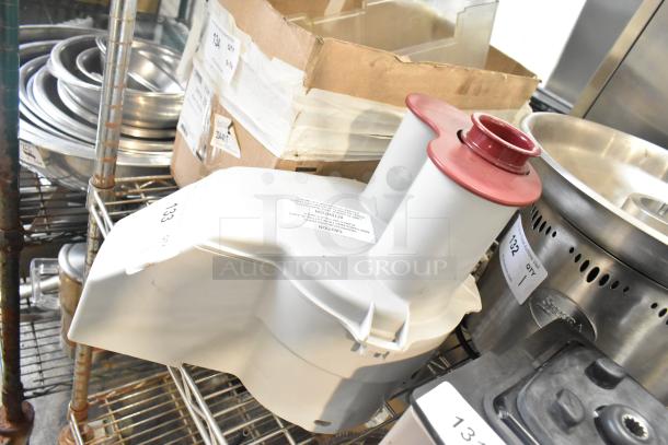 Brand new gray poly continuous feed head attachment for food processor, scratch and dent condition, with red-topped chute.