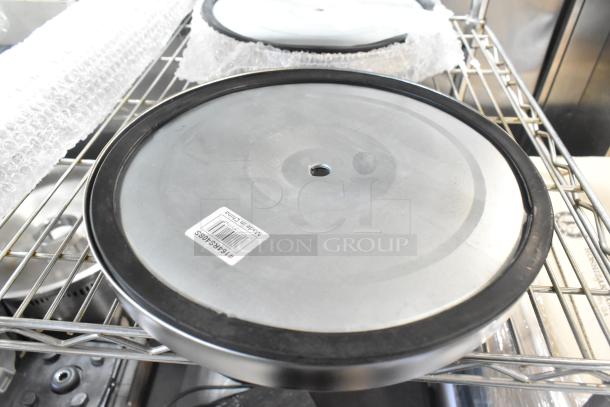 Brand new Lancaster Table & Seating stanchion base, scratch and dent condition, with product tag and Made in China label.