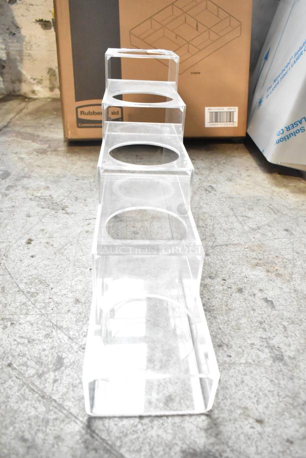 Clear acrylic lid dispenser, four compartments, in good condition. Includes Rubbermaid box in background, for auction.