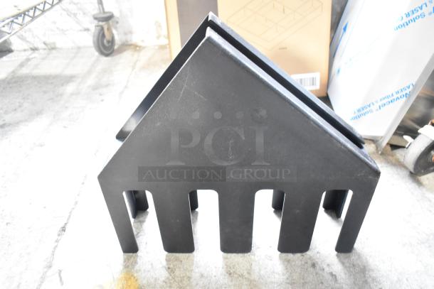 Alt text: Black lid dispenser with multiple slots, small scratches visible, sturdy plastic construction, part of a 7-item auction.