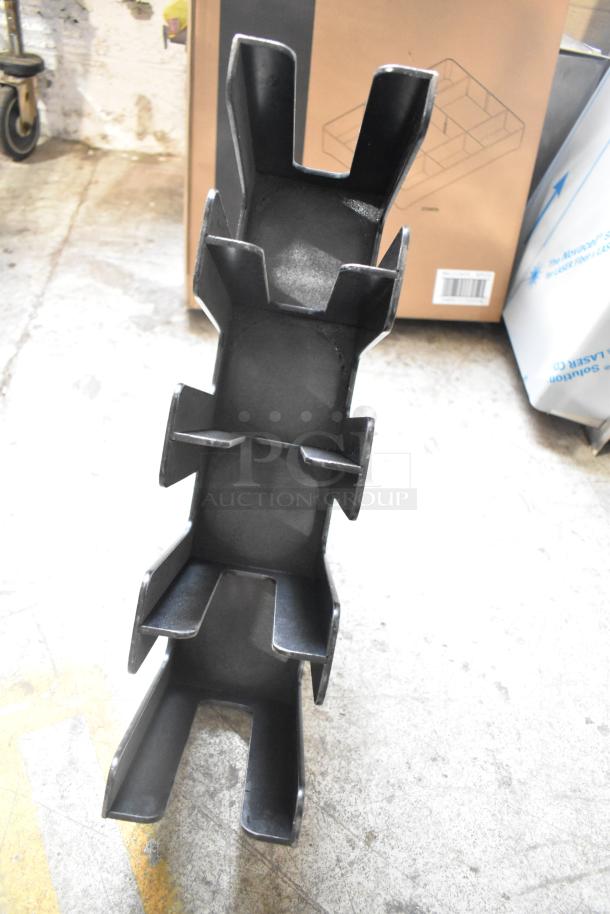 Stackable plastic lid dispenser; black, slight wear, vertical design, part of 7-item auction lot, ideal for organizing lids.