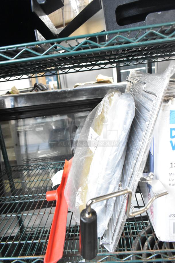 Four brand new Carlisle 3656805 Sparta 24" red single blade rubber squeegees with plastic frames, in packaging.