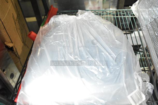 Four brand new Carlisle Sparta 24" red rubber squeegees, plastic frame, wrapped in plastic with some visible packaging defects.