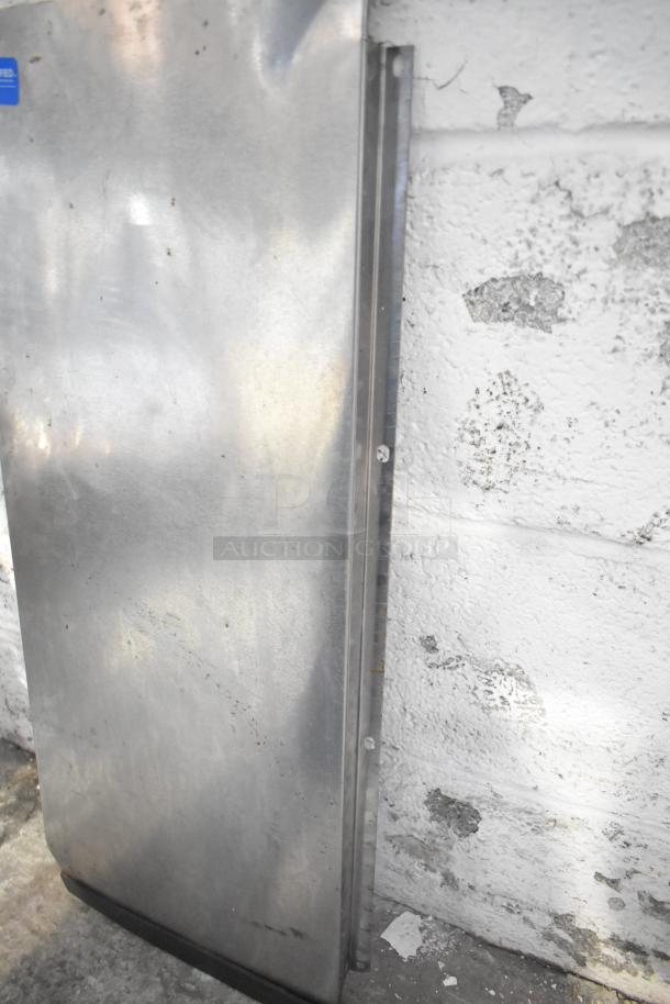 Metal sheet from tier lot auction, showing light wear. Part of a collection with various items including a blue poly rack.