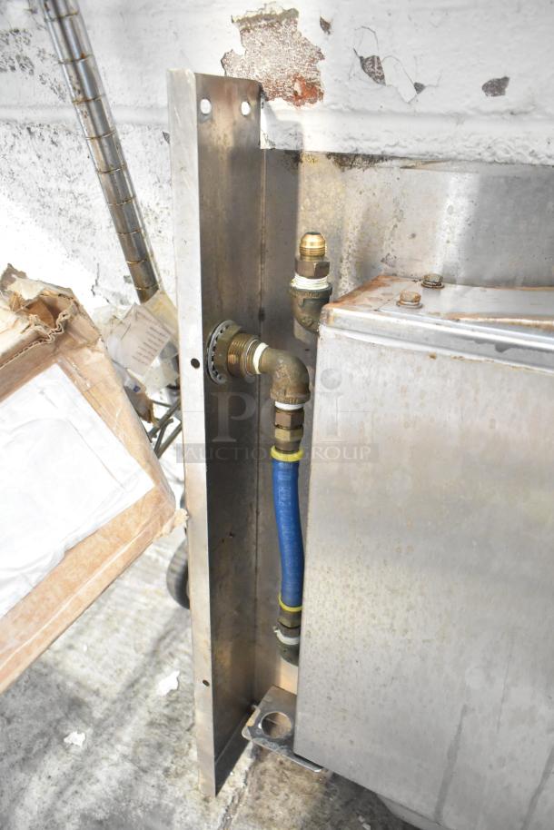 Lot featuring metal pieces, rusted metal frame, and blue poly rack. Includes various fittings and connectors. Condition is worn.