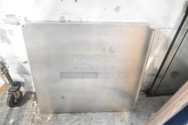 Metal sheet with curved edge, part of the ALL ONE MONEY! tier lot. Includes various items like metal pieces and a blue poly rack.