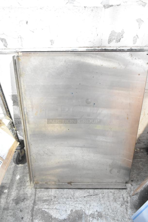 ALL ONE MONEY! Tier Lot with metal pieces and blue poly rack. Metal shows signs of wear; rugged condition.