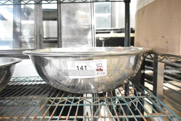 25 metal bowls on a shelf with label "141, QTY APEX x-25". Stainless steel construction, good condition.