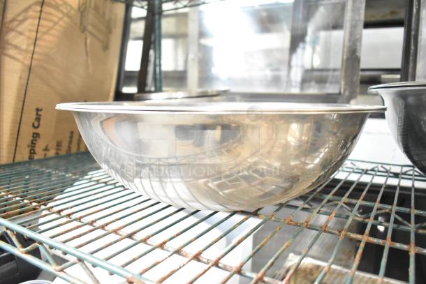 25 various metal bowls on wire shelf, shiny finish, good condition, available at auction, 25 times your bid offer.