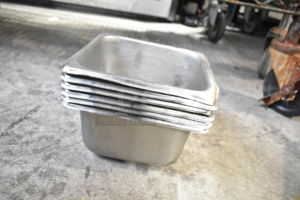 Stack of stainless steel drop-in bins, used condition, part of a mixed lot including a beverage dispenser, on auction.