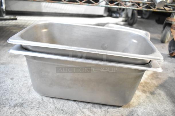 Stainless steel drop-in bins, shown stacked, part of tiered auction lot. Used condition, no visible labels.