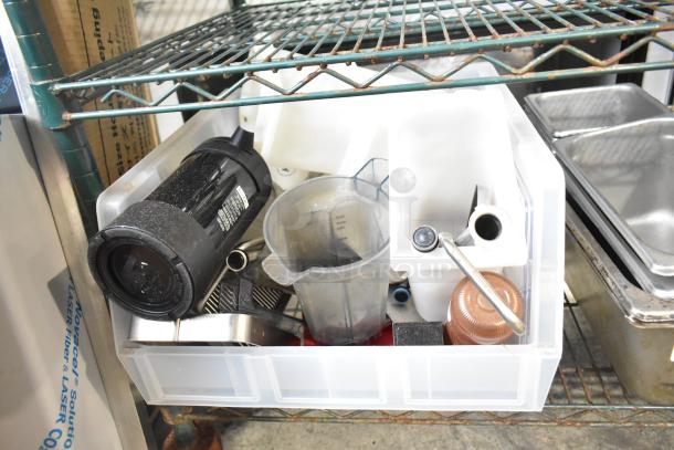 Mixed lot of kitchen items including drop-in bins, a beverage dispenser, and various containers on a shelf; used condition.