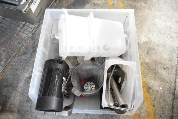 A bin containing assorted items including drop-in bins, a beverage dispenser, and metal components. Items appear in used condition.