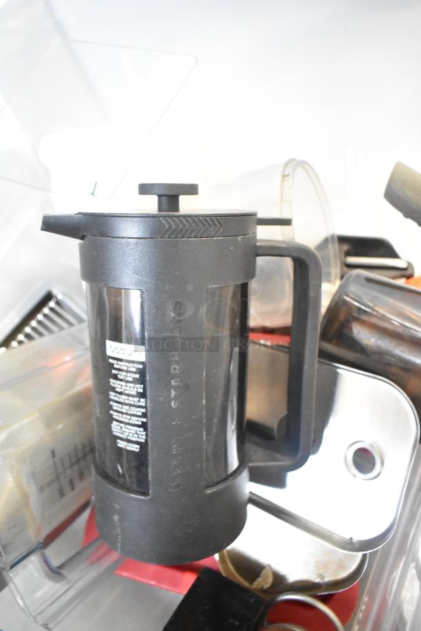 Alt text: "Tier lot with Bodum Starbucks coffee press, drop-in bins, and beverage dispenser. Items are in good condition."