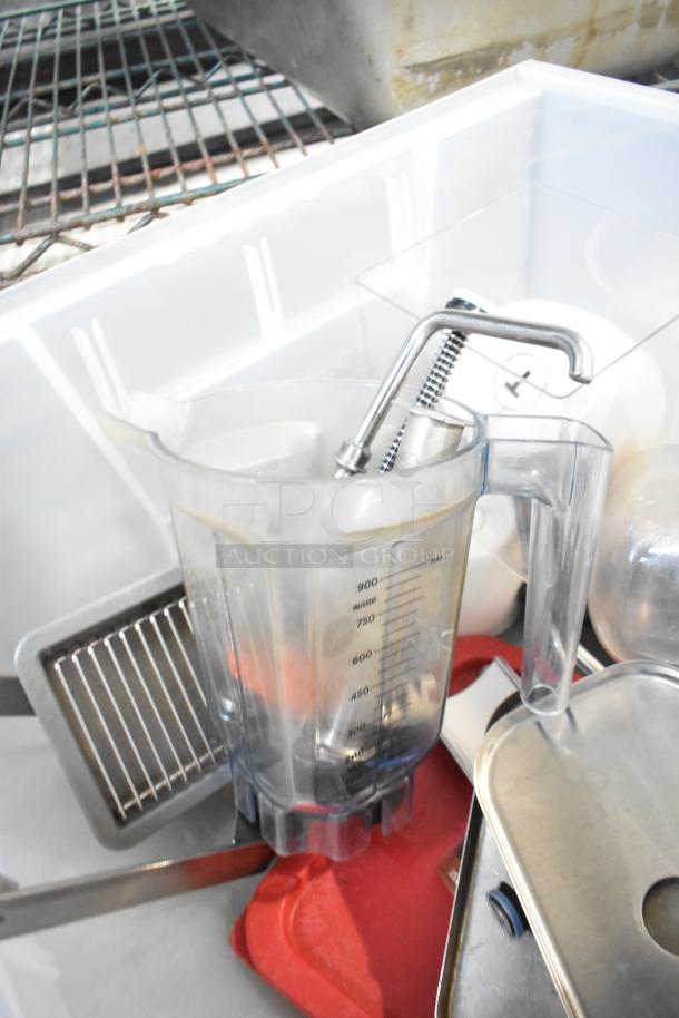 Tier lot of assorted items including a clear plastic beverage dispenser, metal drop-in bins, and a red tray; gently used condition.