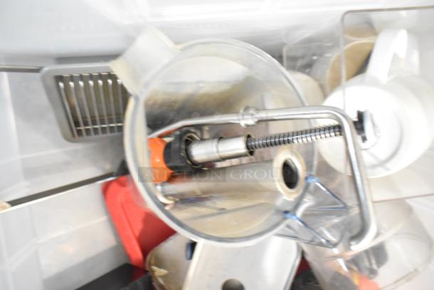 Auction lot of assorted items including drop-in bins, beverage dispenser, metal parts, and kitchen tools. Items in used condition.