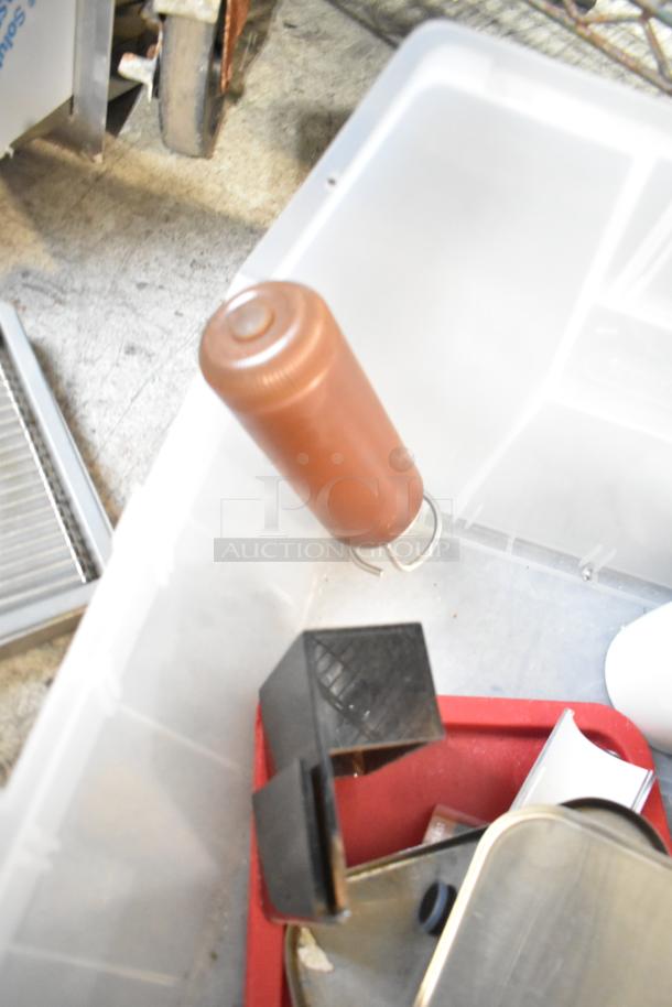 Lot of various items including drop-in bins and a beverage dispenser in a plastic container. Items appear used.
