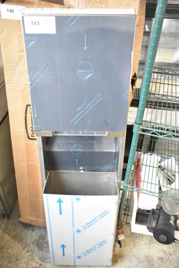 Brand new wall mount trash can with paper towel dispenser, slight scratches, protective film covering, labeled with “POLIFILM.”