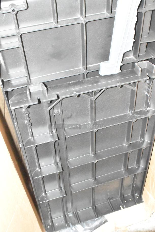 BRAND NEW SCRATCH AND DENT Rubbermaid® 2202527 housekeeping cart base; black plastic, accessory bundle included.